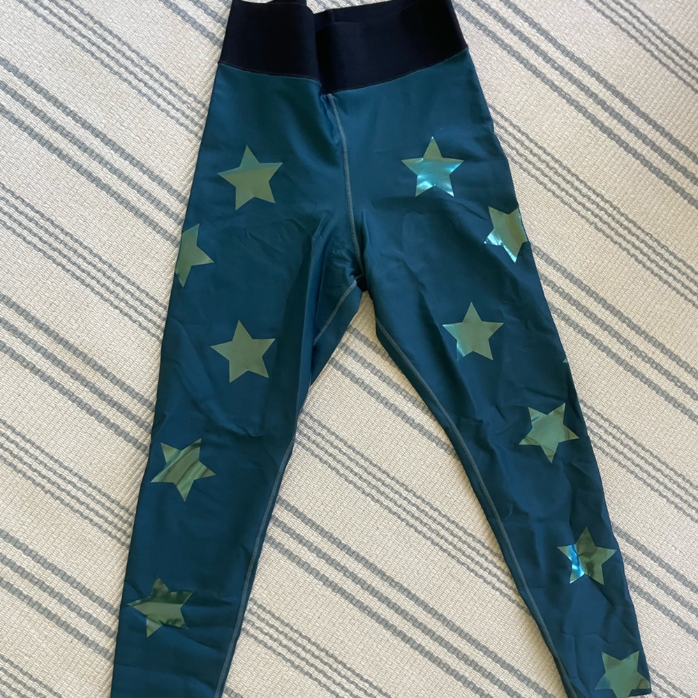 Ultracor x Barry’s aqua blue metallic star leggings